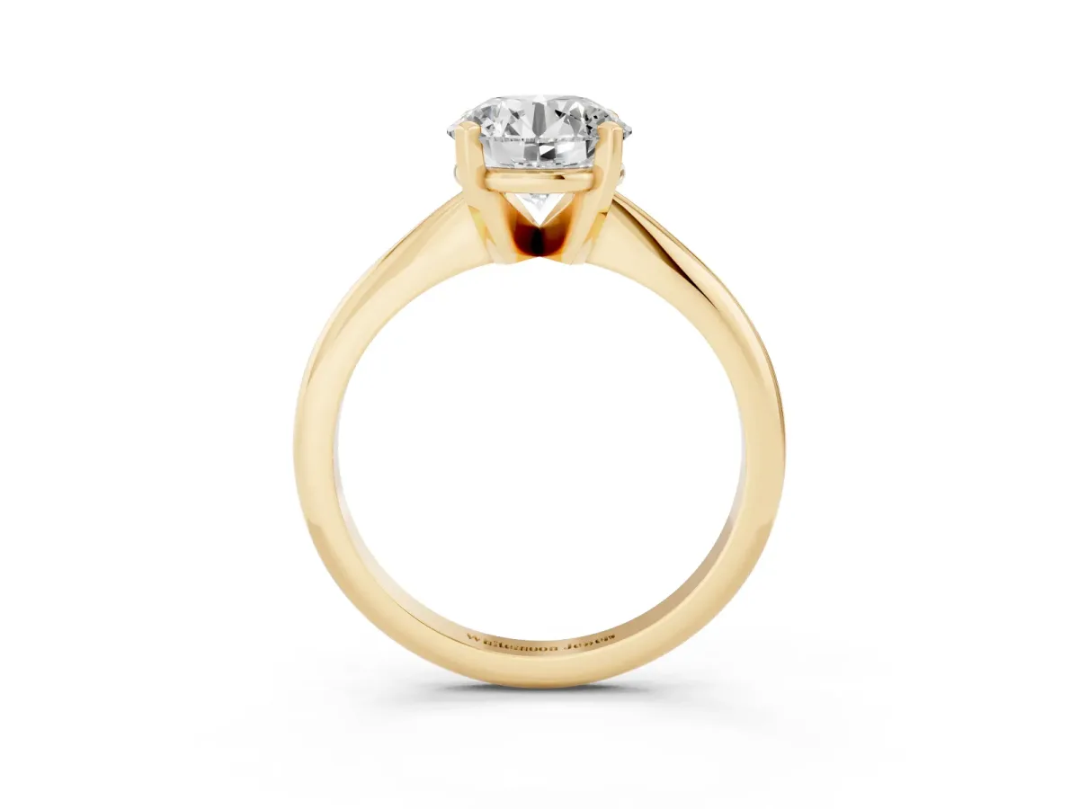 Round Cut Cut Solitaire Ring with Four-Prong Setting on a Classic Band Yellow gold