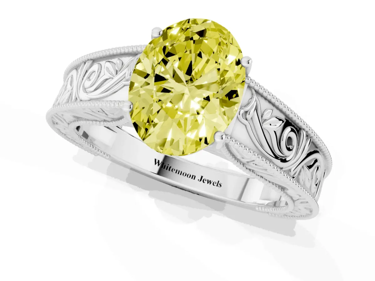 Fancy Yellow Oval Cut Diamond Solitaire Ring with Engraved Band and Four-Prong Setting Silver