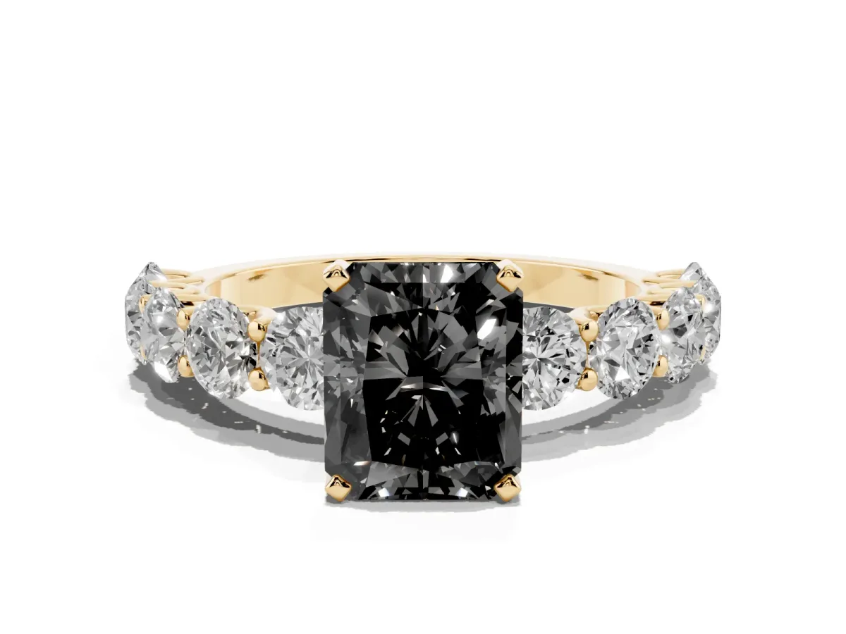 Fancy Black Radiant Cut Diamond Prong Setting with Side Stones on a Pave Band Yellow gold