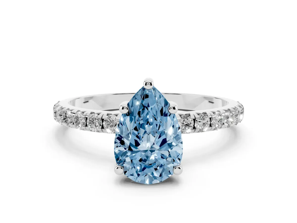 Fancy Blue Pear Cut Cut Diamond Solitaire Ring with Micro Pave Band and Four Prong Setting Silver