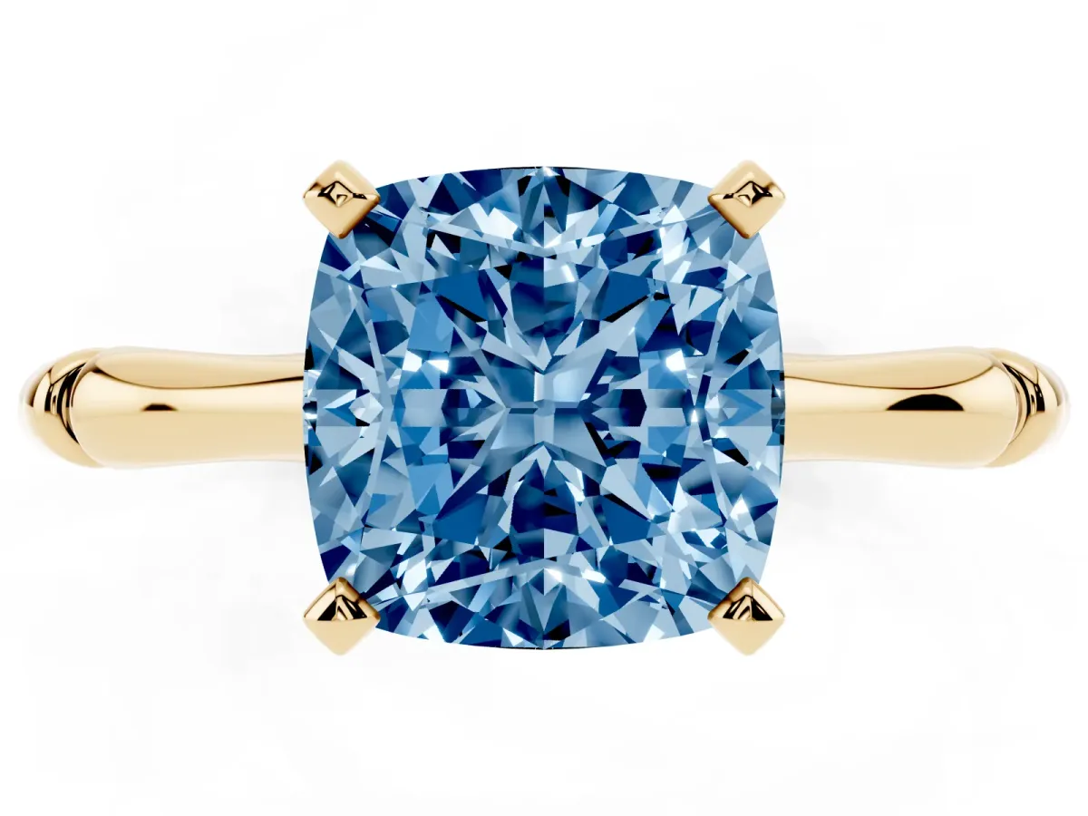 Fancy Blue Cushion Cut Solitaire Diamond Ring with Bamboo Band and Four-Prong Setting Yellow gold