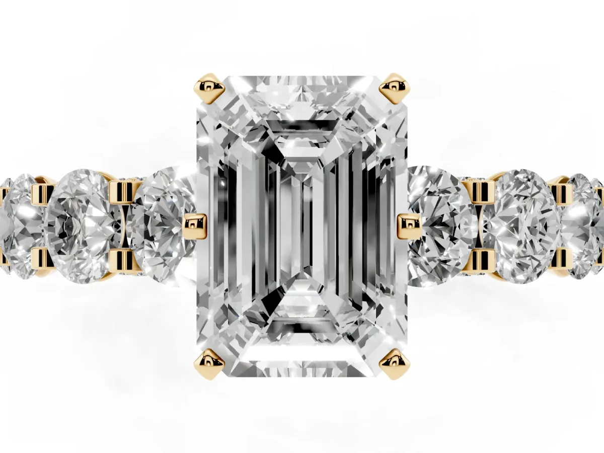 Emerald Cut Diamond Side Stone Engagement Ring with Four-Prong Setting Yellow gold