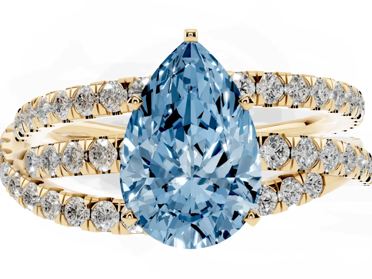 Fancy Blue Pear Cut Solitaire Twist Band with Pavé Setting and Four-Prong Setting Yellow gold