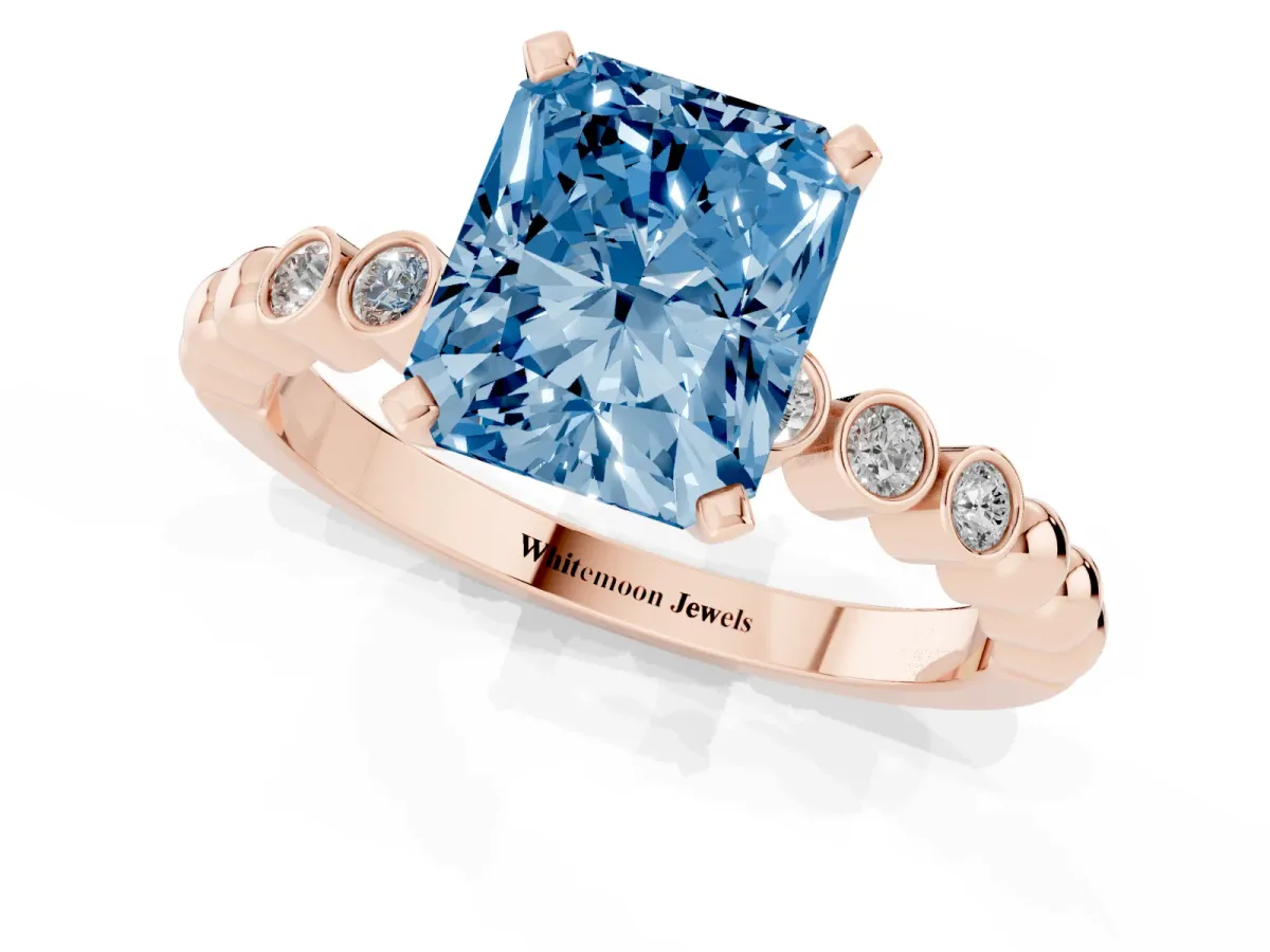 Fancy Blue Radiant Cut Solitaire Bezel Accent Diamond Engagement Ring with Beaded Band and Four-Prong Setting Rose gold