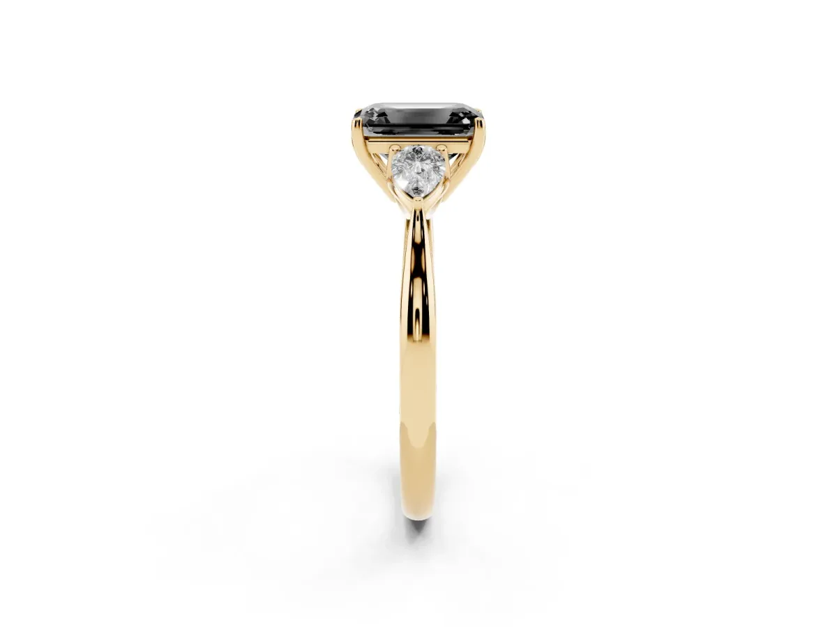 Fancy Black Three-Stone Emerald Cut Brilliant Diamond Solitaire Ring with Tapered Band and Four-Prong Setting Yellow gold