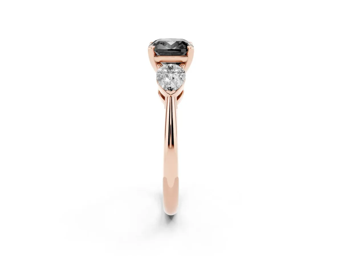 Fancy Black Three-Stone Cushion Cut Diamond Ring with Pear Side Stones and Four-Prong Setting Rose gold