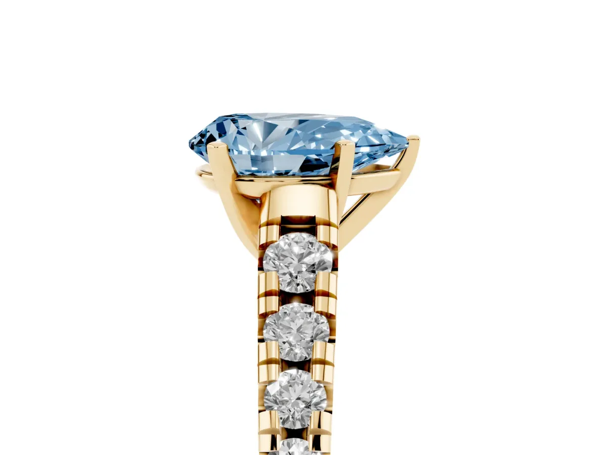 Fancy Blue Pear Cut Diamond Cathedral Solitaire Ring with Round Pavé Band Yellow gold