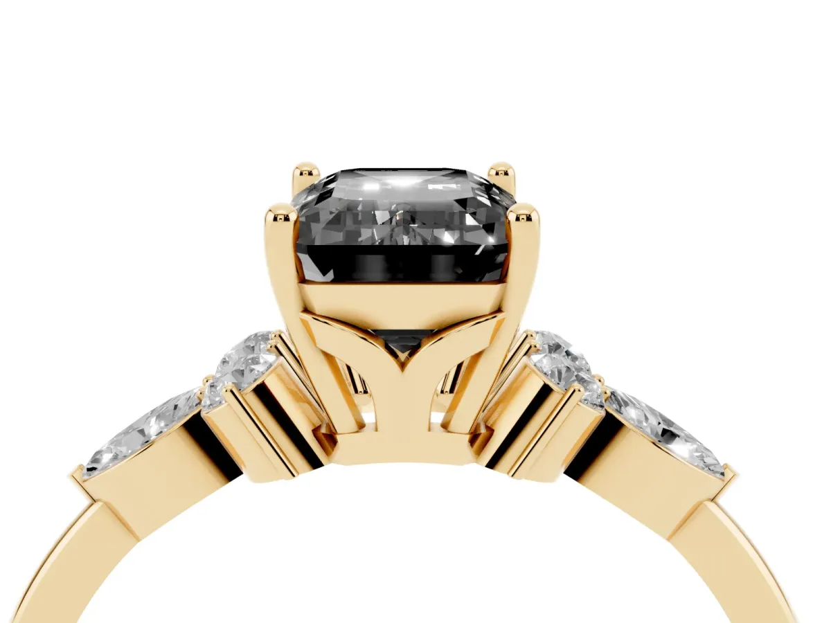 Fancy Black Emerald Cut Brilliant Diamond Solitaire Ring with Pear Side Stones and Four-Prong Setting Yellow gold