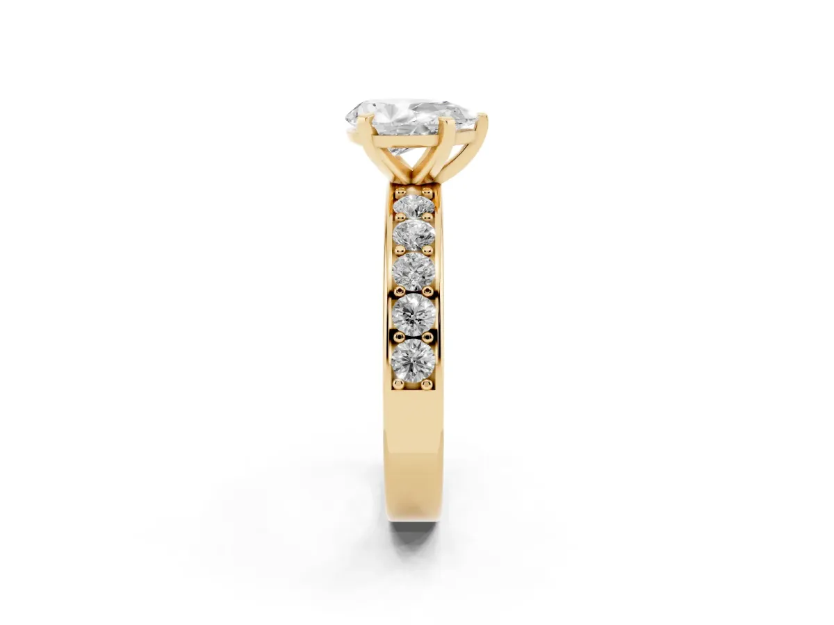 Pear Cut Diamond Engagement Ring with Channel Set Round Band and Prong Setting Yellow gold