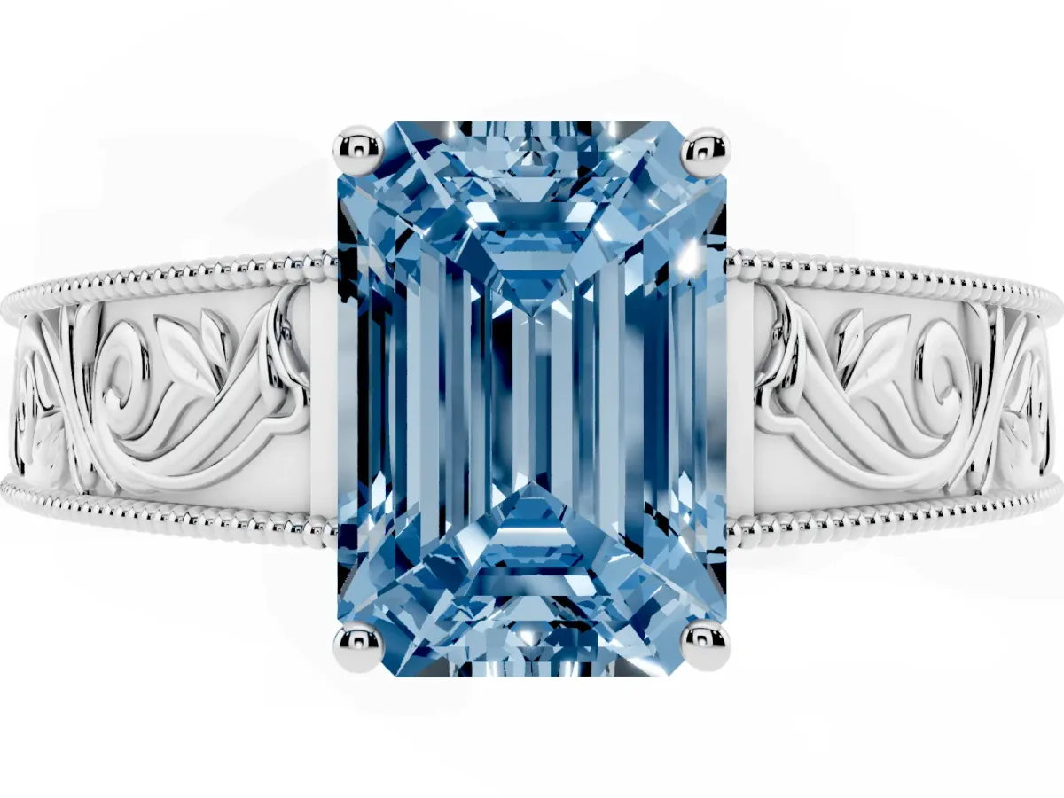 Fancy Blue Emerald Cut Diamond Solitaire Ring with Engraved Band and Four-Prong Setting Platinum