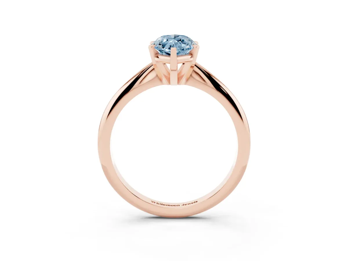Fancy Blue Marquise Cut Cut Solitaire Ring with Four-Prong Setting on a Classic Band Rose gold
