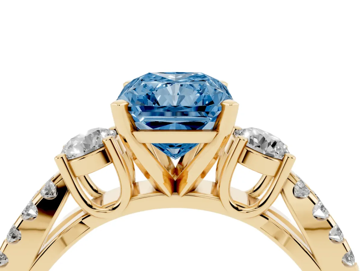Fancy Blue Radiant Cut Diamond Three-Stone Ring with Pavé Split Shank and Four-Prong Setting Yellow gold