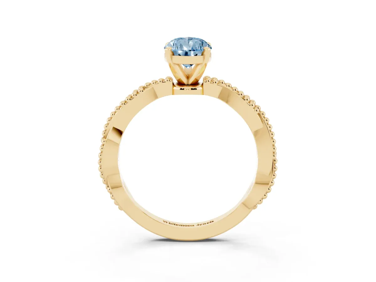 Fancy Blue Pear Cut Solitaire Twisted Band with Bead Prong Setting Yellow gold