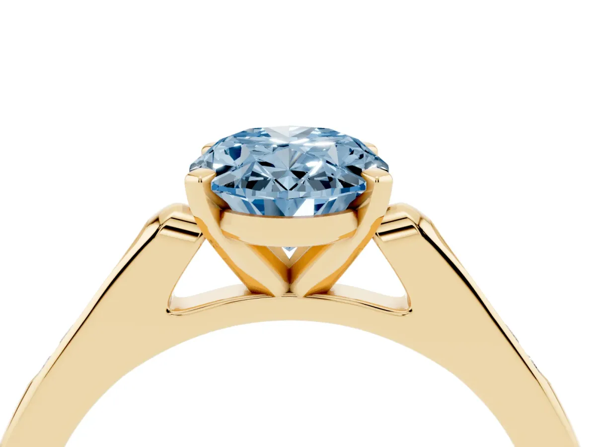 Fancy Blue Oval Cut Diamond Solitaire Ring with Channel Set Round Band and Prong Setting Yellow gold
