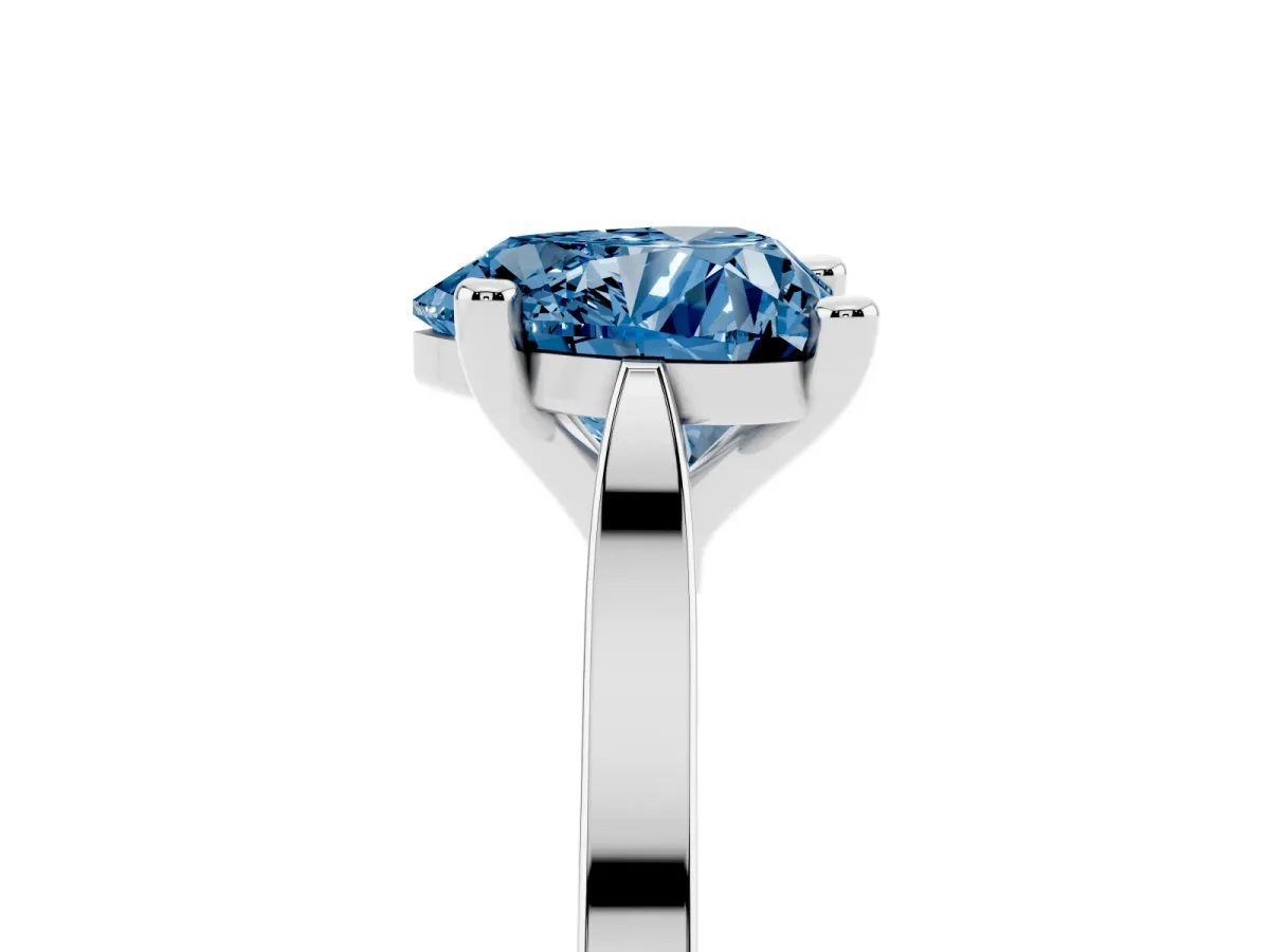 Fancy Blue Heart Cut Solitaire Diamond Ring with Four-Prong Setting and Tapered Band Platinum