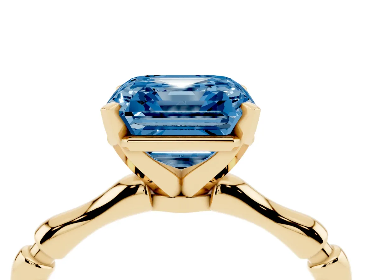 Fancy Blue Asscher Cut Solitaire Diamond Ring with Bamboo Band and Four-Prong Setting Yellow gold