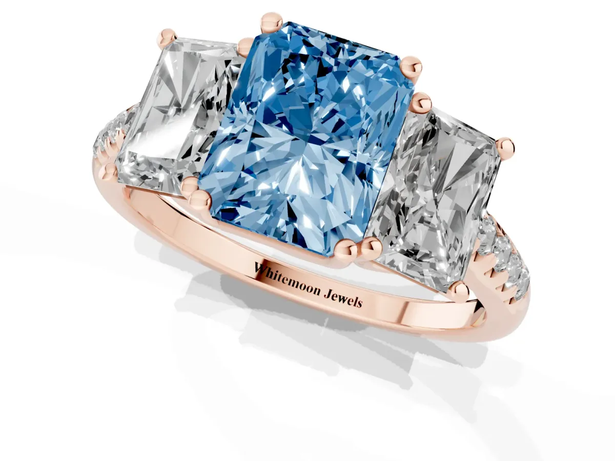 Fancy Blue Three-Stone Radiant Cut Diamond Ring with Round Pavé Band and Prong Setting Rose gold