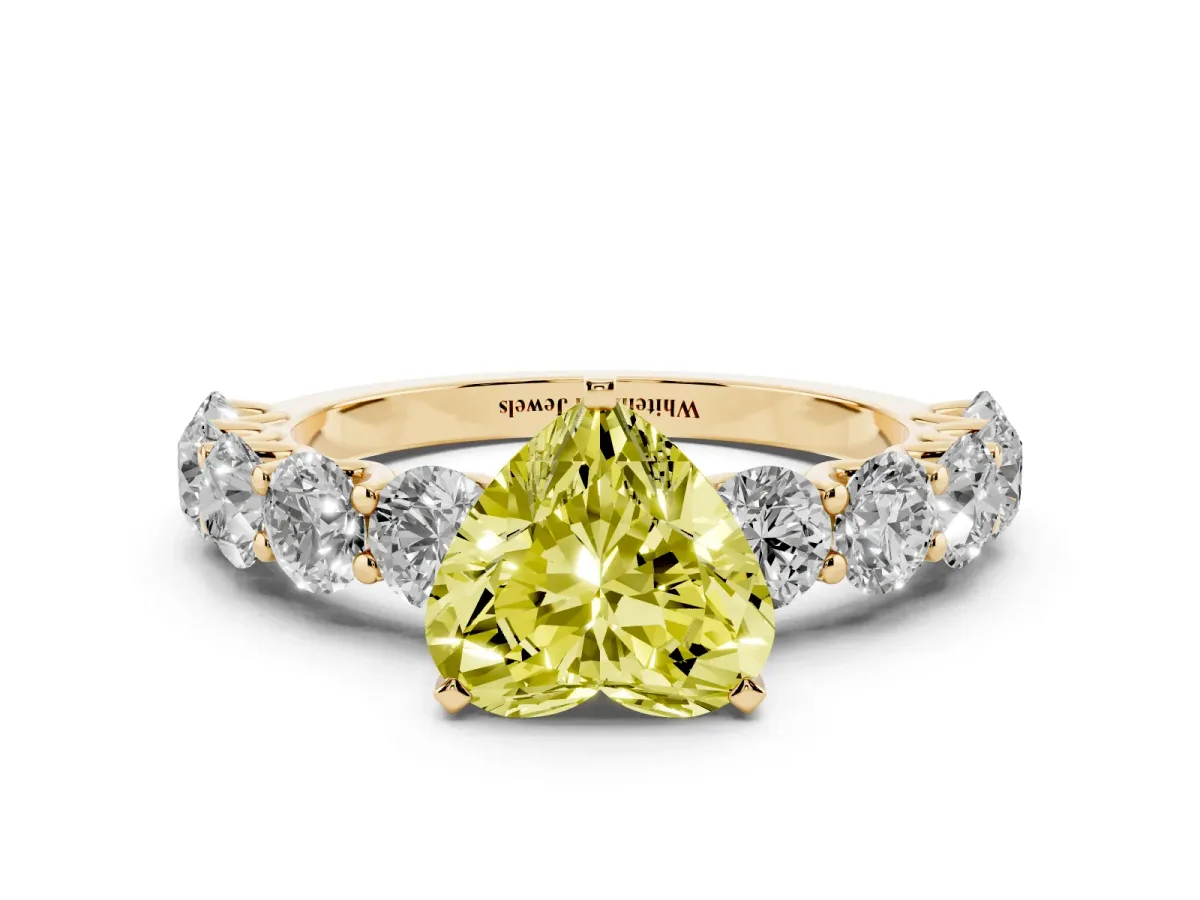 Fancy Yellow Heart Cut Diamond Prong Setting with Side Stones on a Pave Band Yellow gold