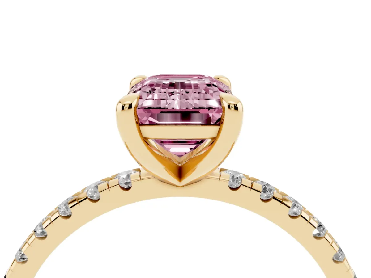 Fancy Pink Emerald Cut Diamond Brilliant Solitaire Ring with Pavé Band and Four-Prong Setting Yellow gold