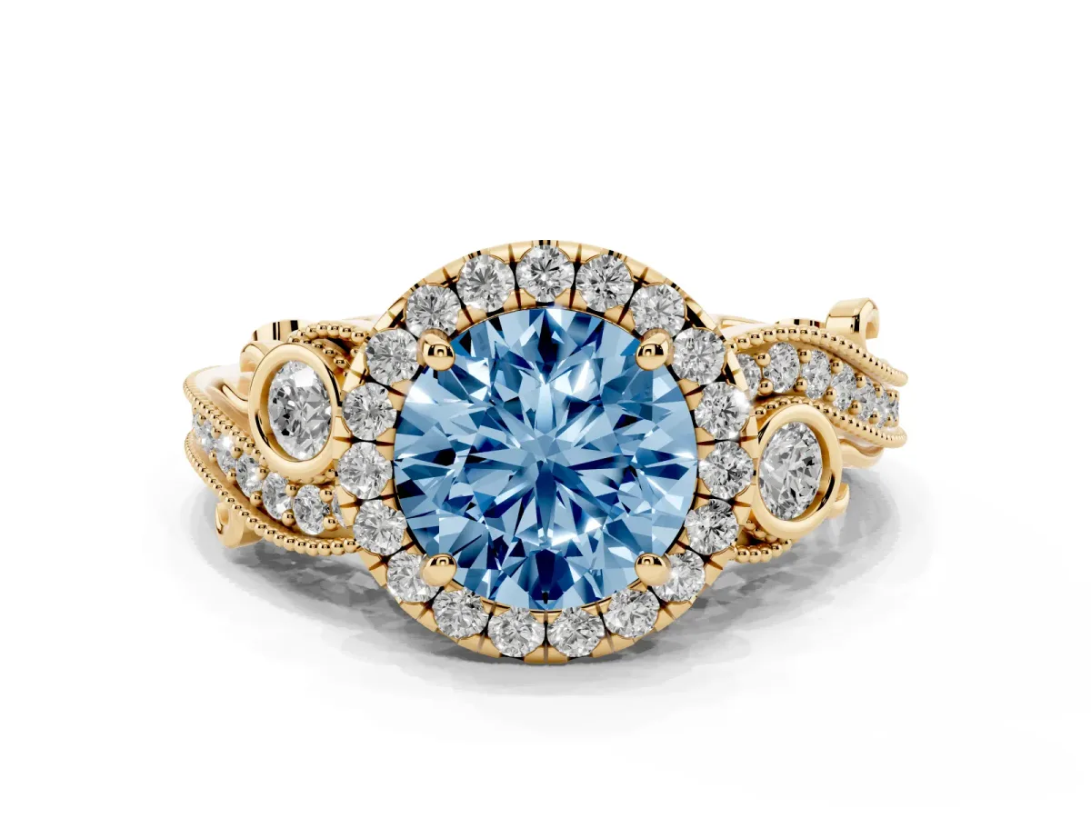 Fancy Blue Round Cut Halo Diamond Ring with Milgrain and Bezel Accents on a Split Shank Band Yellow gold