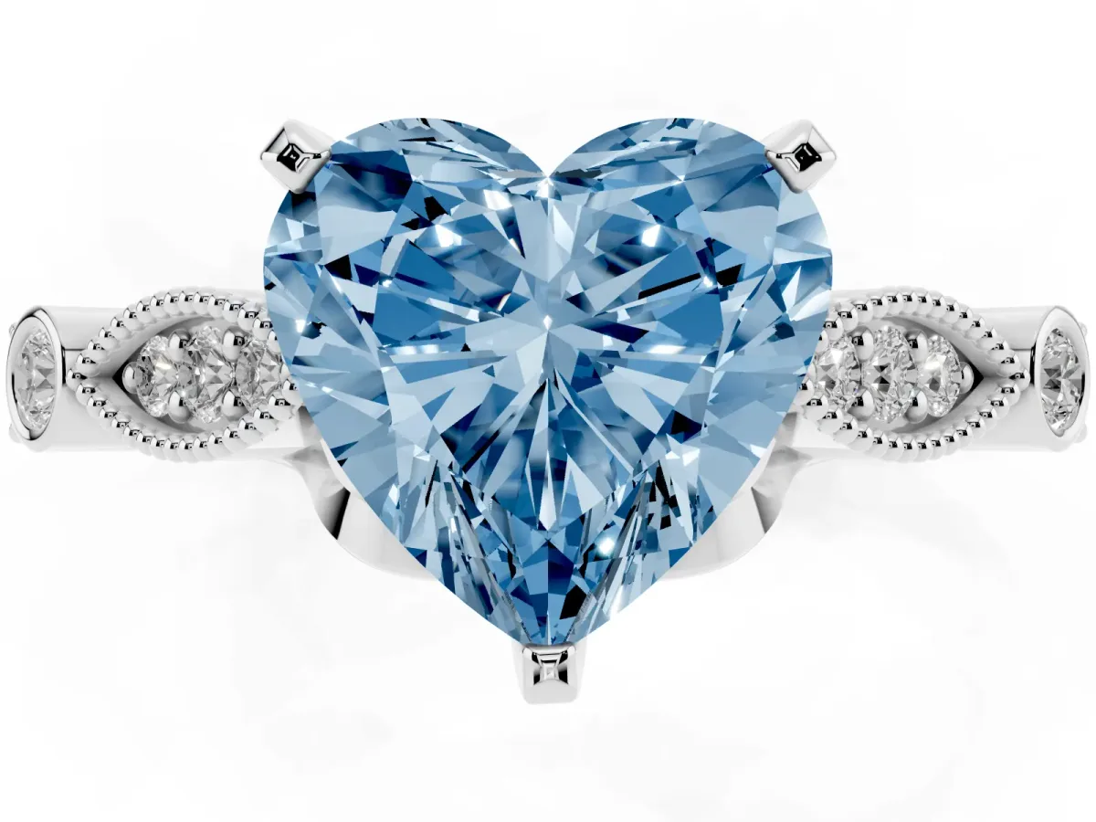 Fancy Blue Heart Cut Cut Diamond with Milgrain Marquise and Bezel Accents on a Solitaire Band with Prong Setting Platinum