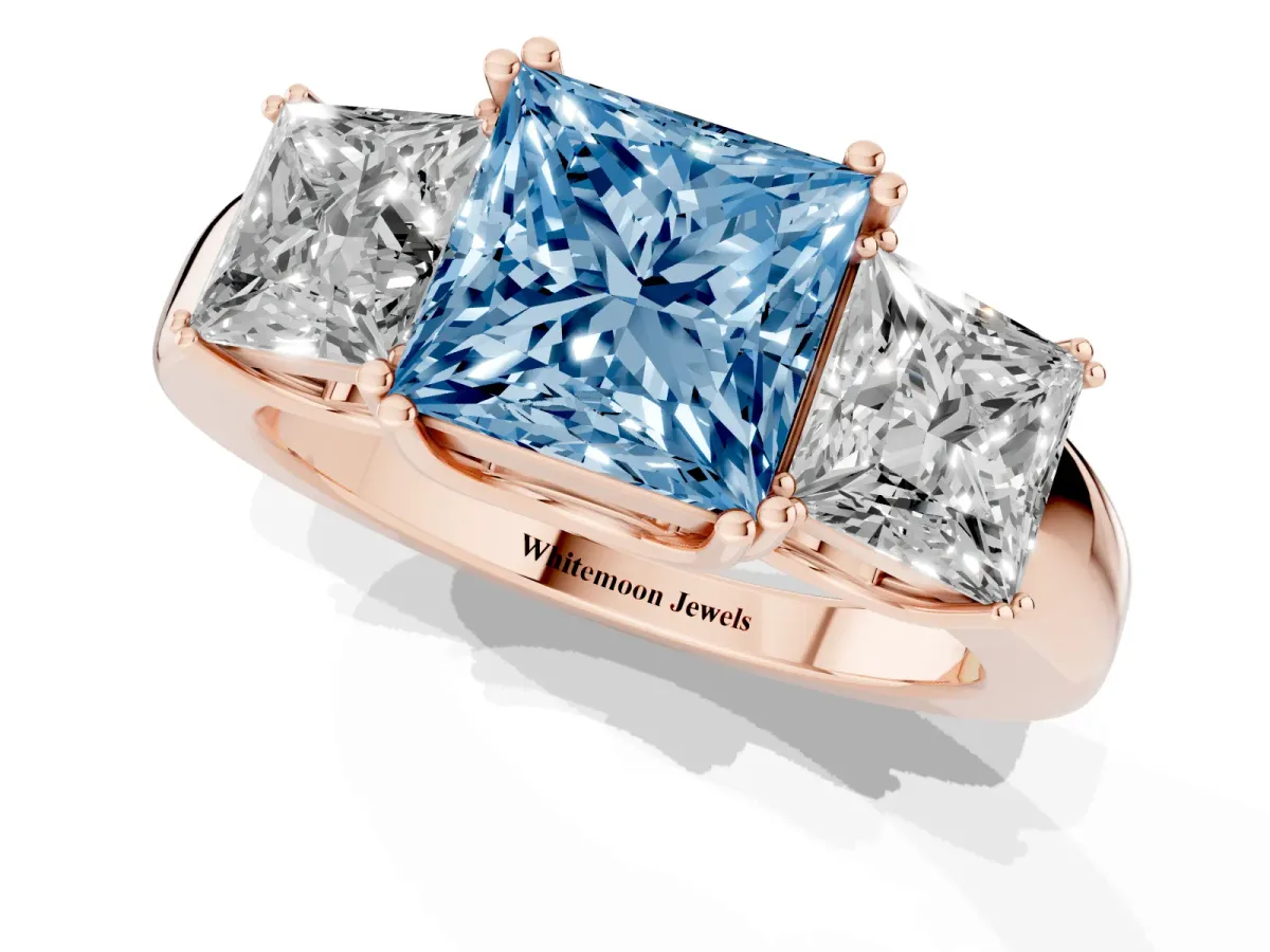 Fancy Blue Three-Stone Princess Cut Cut Diamond Ring with Channel Set Band and Four-Prong Setting Rose gold