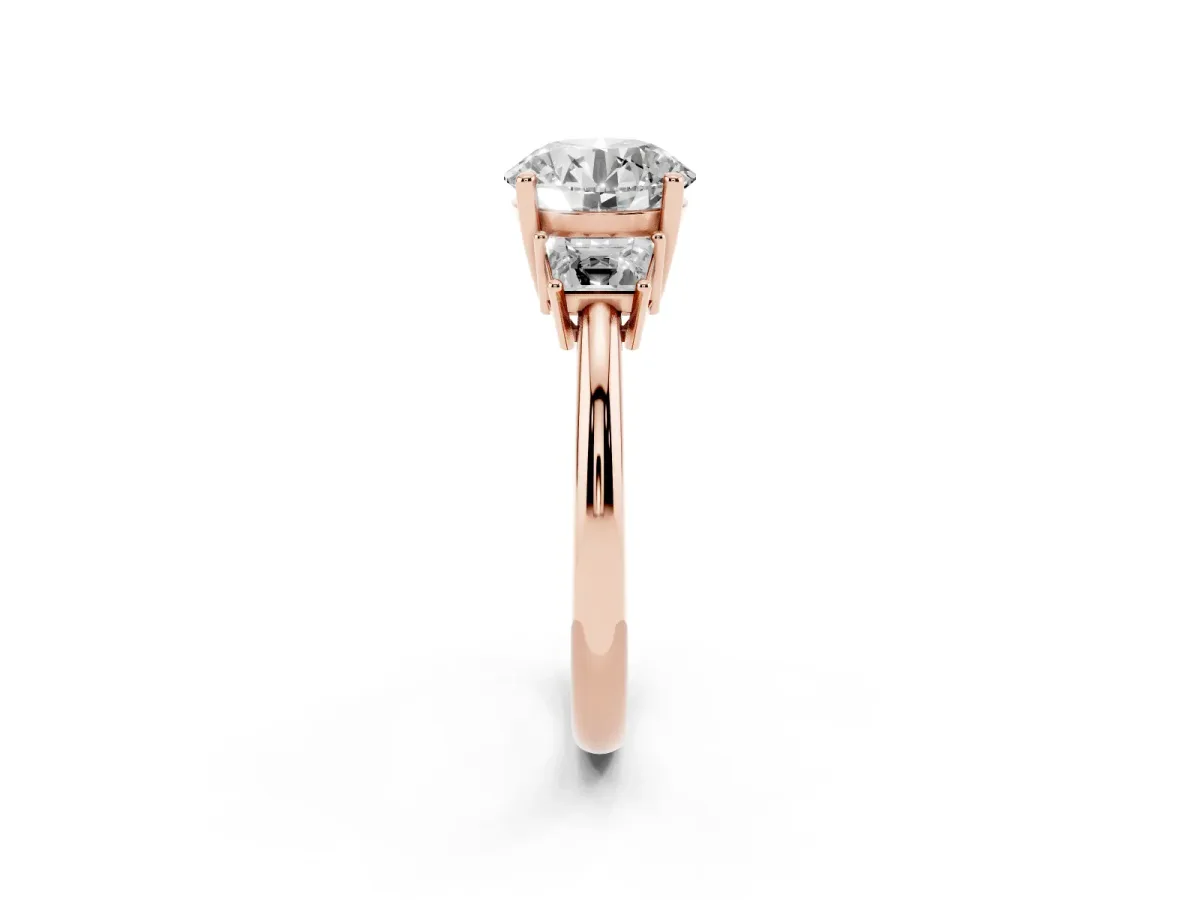 Round Cut Diamond Three-Stone Ring with Trapezoid Side Stones and Prong Setting Rose gold