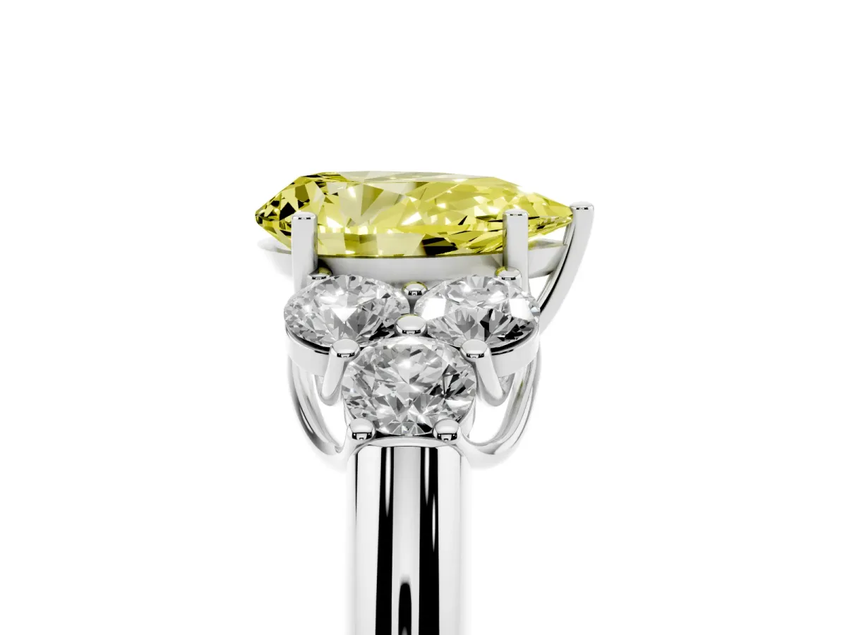 Fancy Yellow Pear Cut Cut Diamond Cluster Ring with Round Accent Stones and Prong Setting on a Classic Band Silver