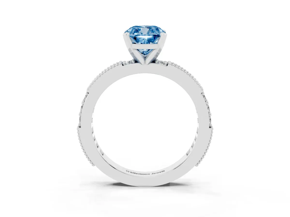 Fancy Blue Cushion Cut Solitaire with Pavé Band and Four-Prong Setting Silver