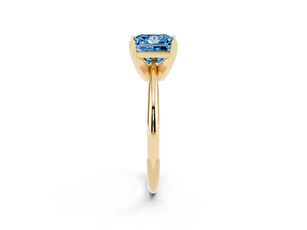 Fancy Blue Princess Cut Cut Solitaire Ring with Four-Prong Setting on a Classic Band Yellow gold