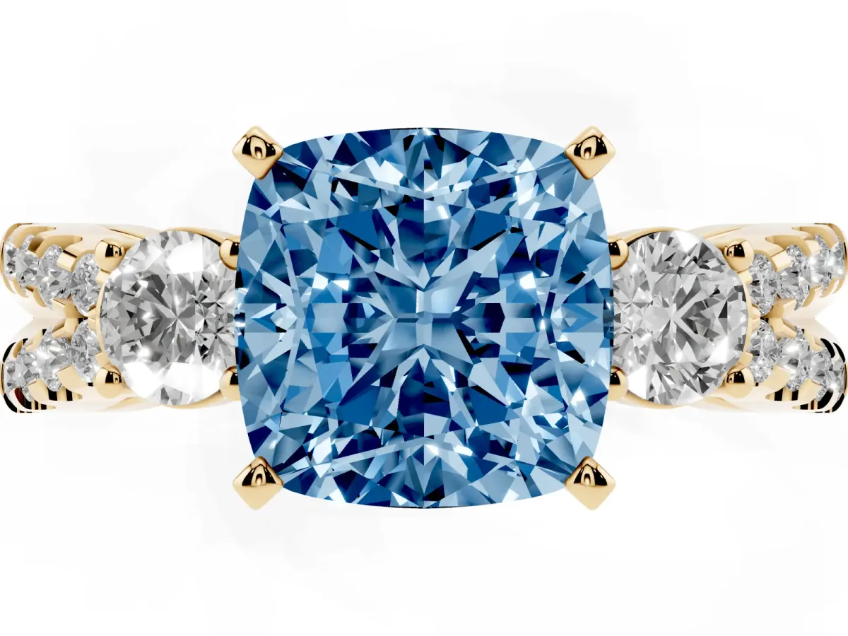 Fancy Blue Cushion Cut Diamond Three-Stone Ring with Pavé Split Shank and Four-Prong Setting Yellow gold