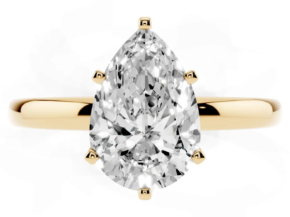 Pear Cut Solitaire Diamond Ring with Six-Prong Setting on a Classic Band Yellow gold