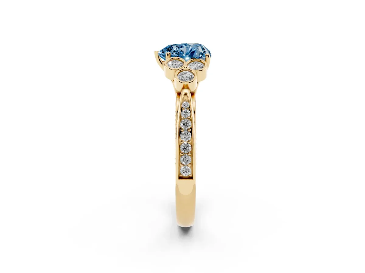 Fancy Blue Heart Cut Cut Diamond Engagement Ring with Bezel Set Round Side Stones and Prong Setting Yellow gold