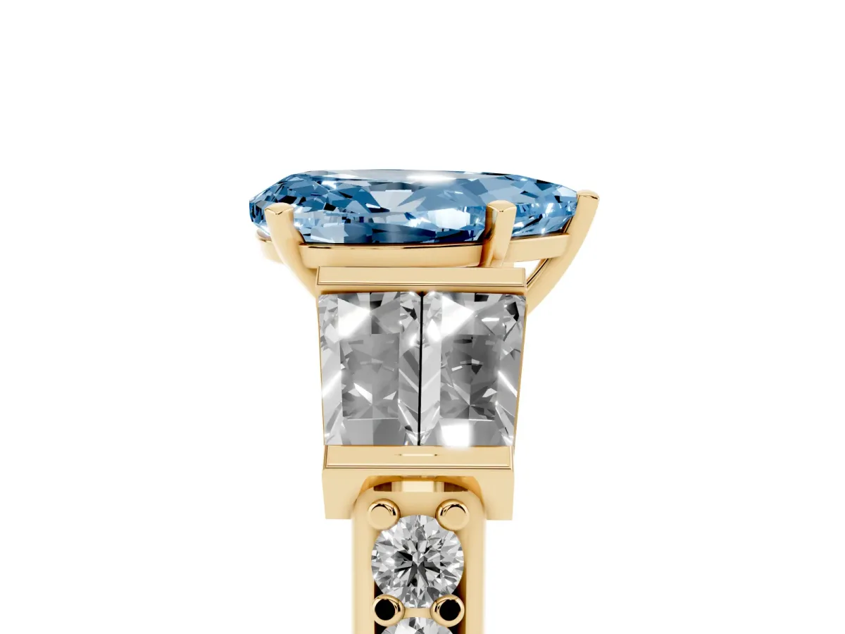 Fancy Blue Pear Cut Diamond Engagement Ring with Baguette Side Stones and Channel Set Band Yellow gold