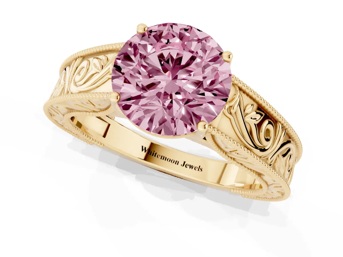 Fancy Pink Round Cut Diamond Solitaire Ring with Engraved Band and Four-Prong Setting Yellow gold
