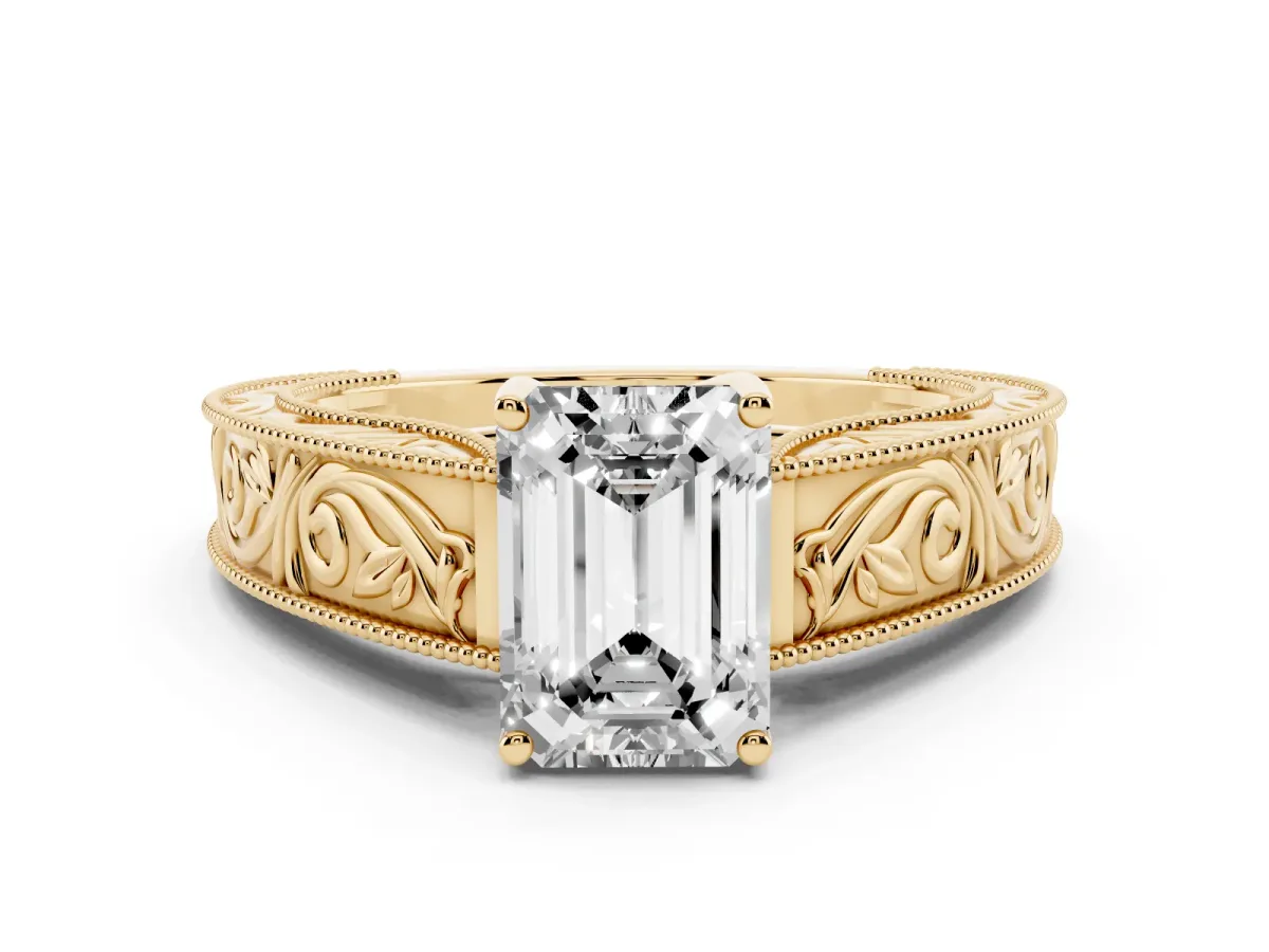 Emerald Cut Diamond Solitaire Ring with Engraved Band and Four-Prong Setting Yellow gold