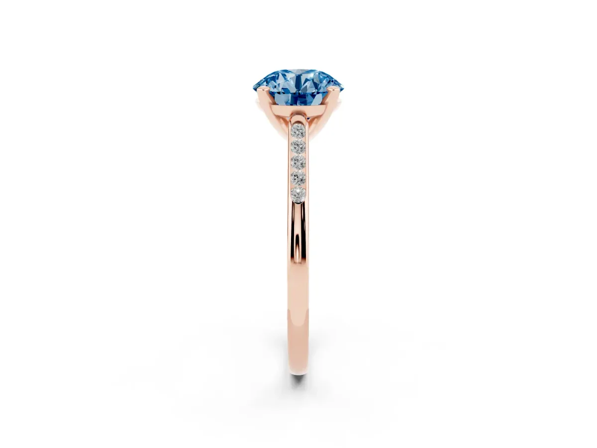 Fancy Blue Round Cut Diamond Solitaire Ring with Channel Set Round Band and Prong Setting Rose gold