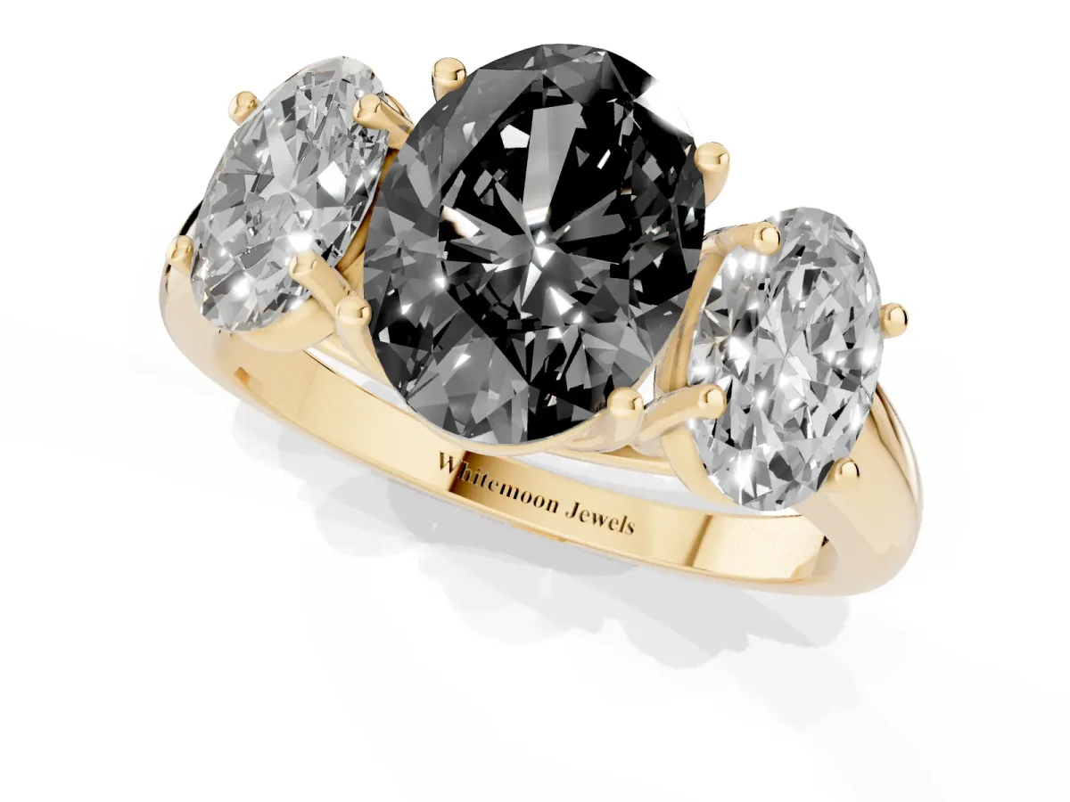 Fancy Black Three-Stone Oval Cut Diamond Engagement Ring with Prong Setting Yellow gold