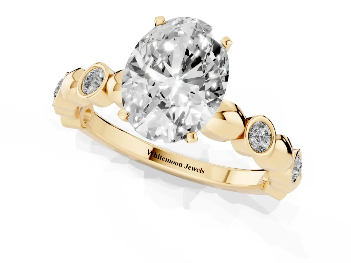 Oval Cut Solitaire Bezel-Set Diamond Ring with Beaded Band and Four-Prong Setting Yellow gold