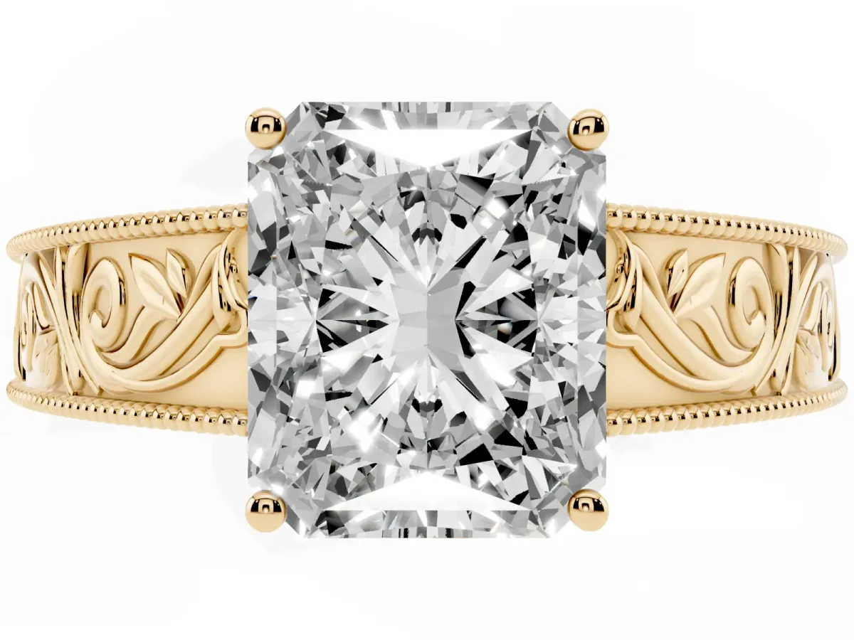 Radiant Cut Diamond Solitaire Ring with Engraved Band and Four-Prong Setting Yellow gold