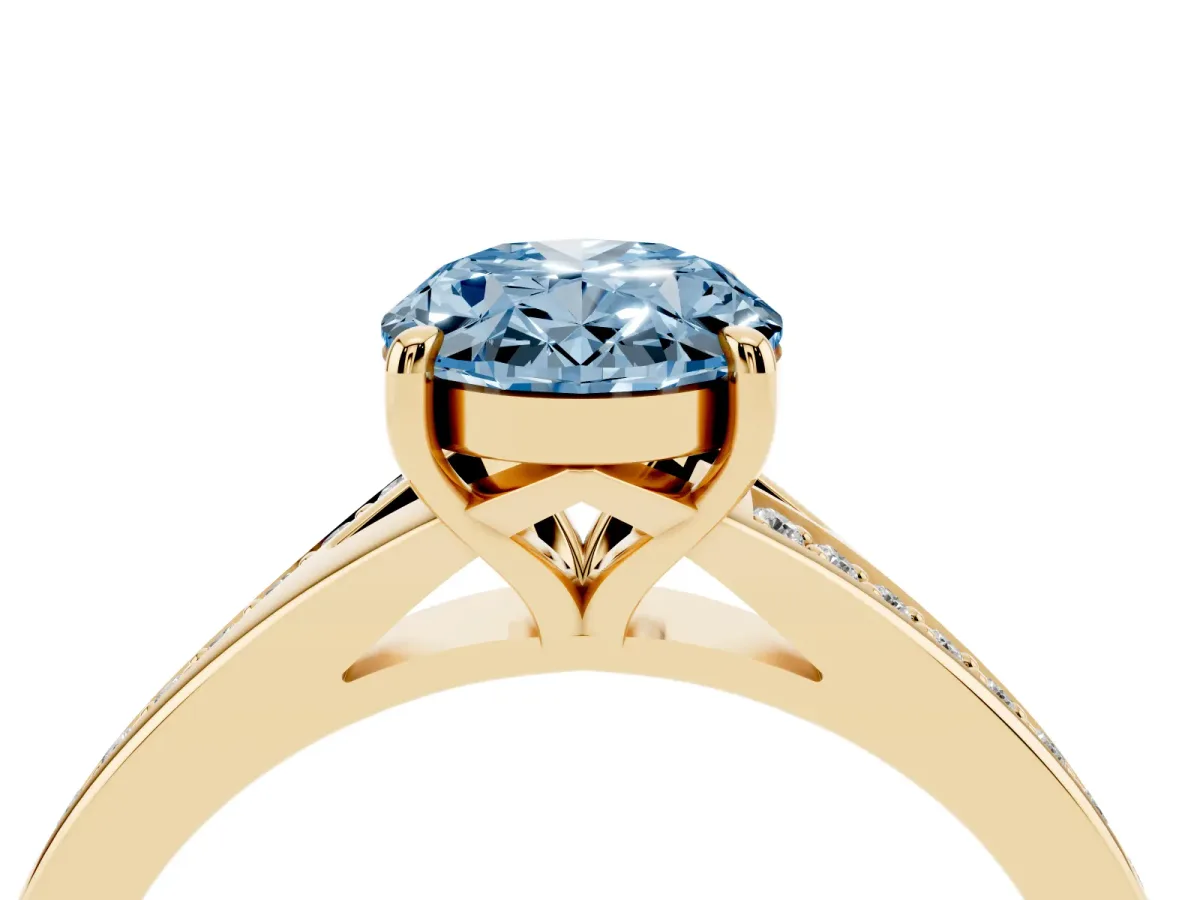 Fancy Blue Oval Cut Diamond Solitaire Ring with Pavé Band and Prong Setting Yellow gold