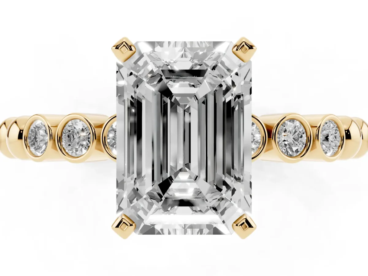 Emerald Cut Solitaire Bezel Accent Diamond Engagement Ring with Beaded Band and Four-Prong Setting Yellow gold