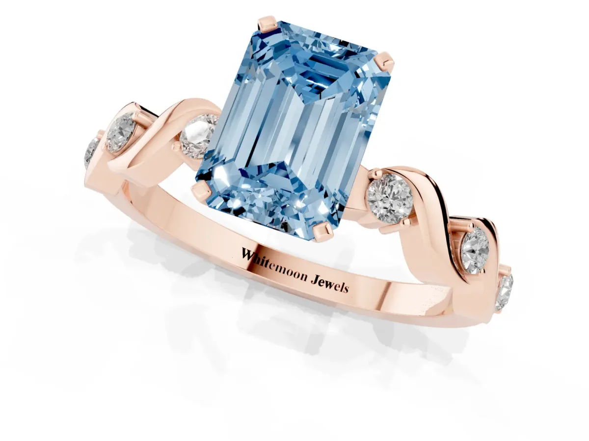 Fancy Blue Emerald Cut Diamond Solitaire Twisted Band with Round Accents and Prong Setting Rose gold