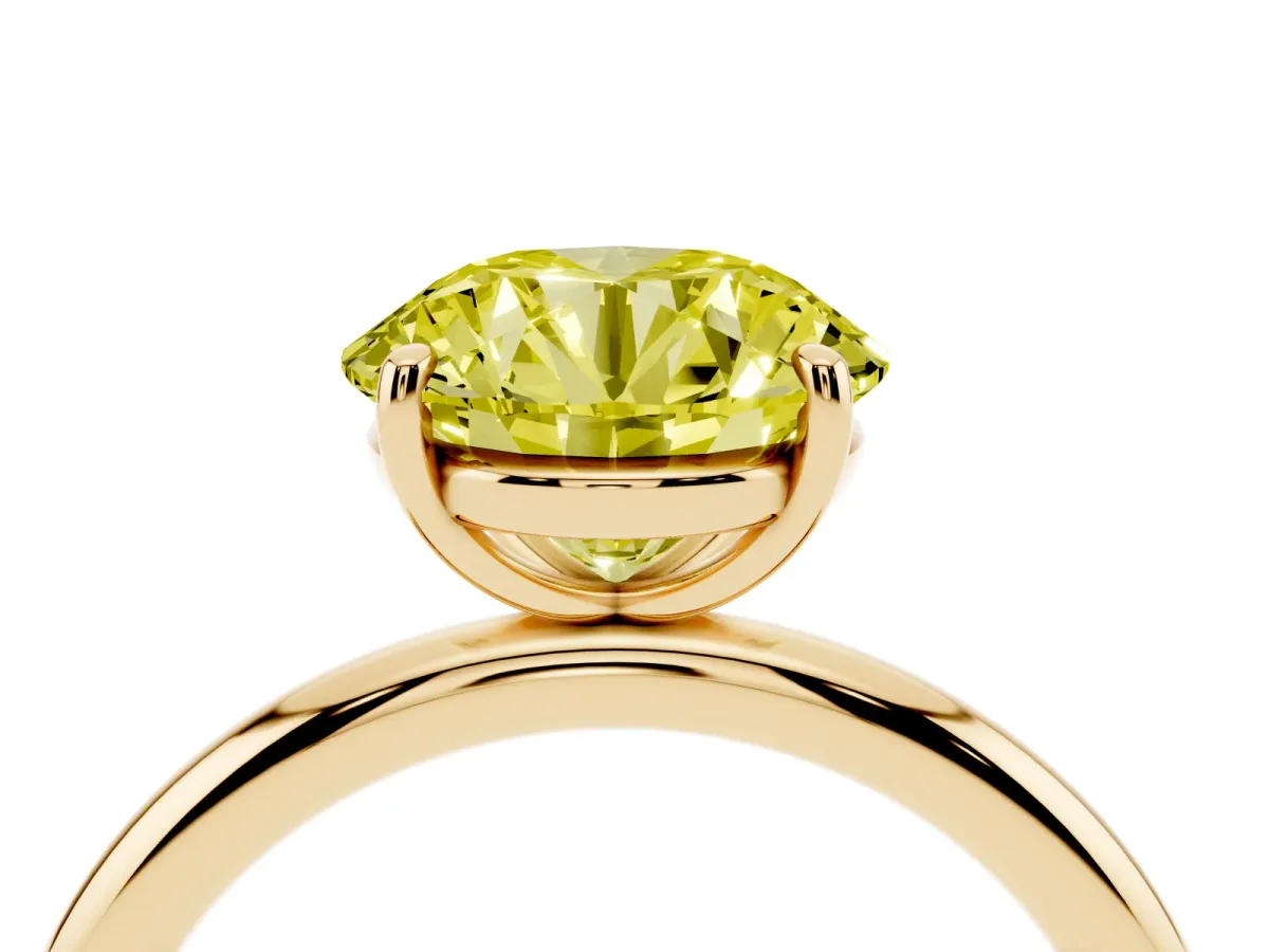 Fancy Yellow Round Cut Solitaire Diamond Ring with Four-Prong Setting on a Plain Band Yellow gold