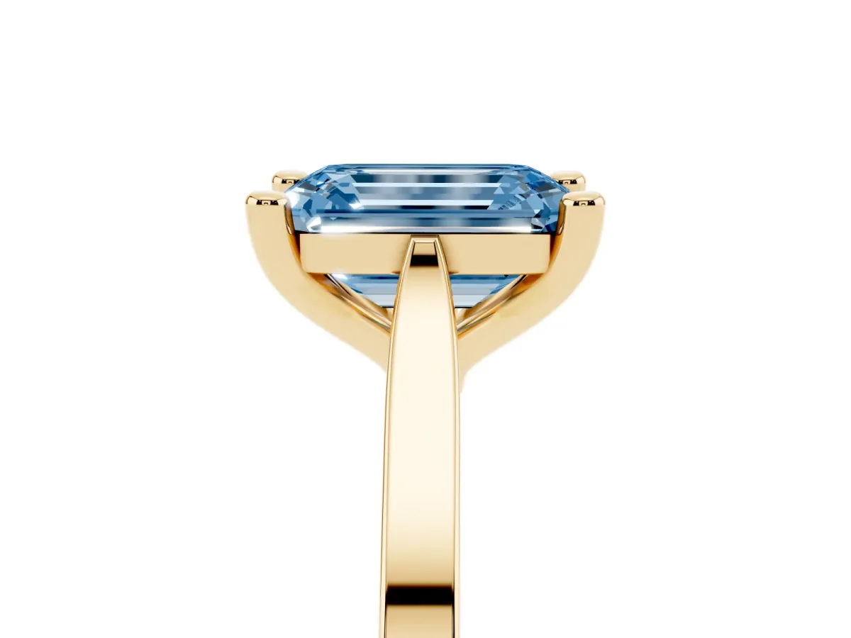 Fancy Blue Emerald Cut Solitaire Diamond Ring with Four-Prong Setting and Tapered Band Yellow gold