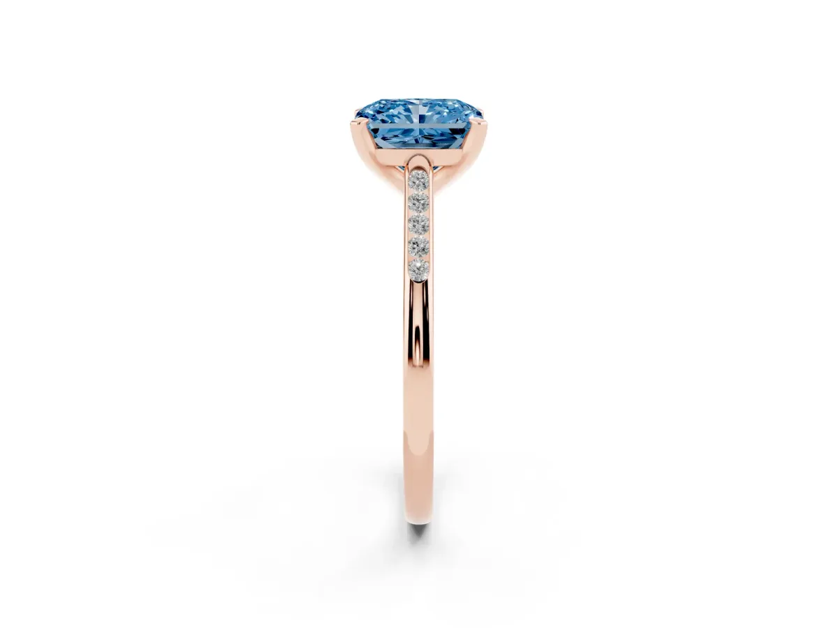 Fancy Blue Radiant Cut Diamond Solitaire Ring with Channel Set Round Band and Prong Setting Rose gold