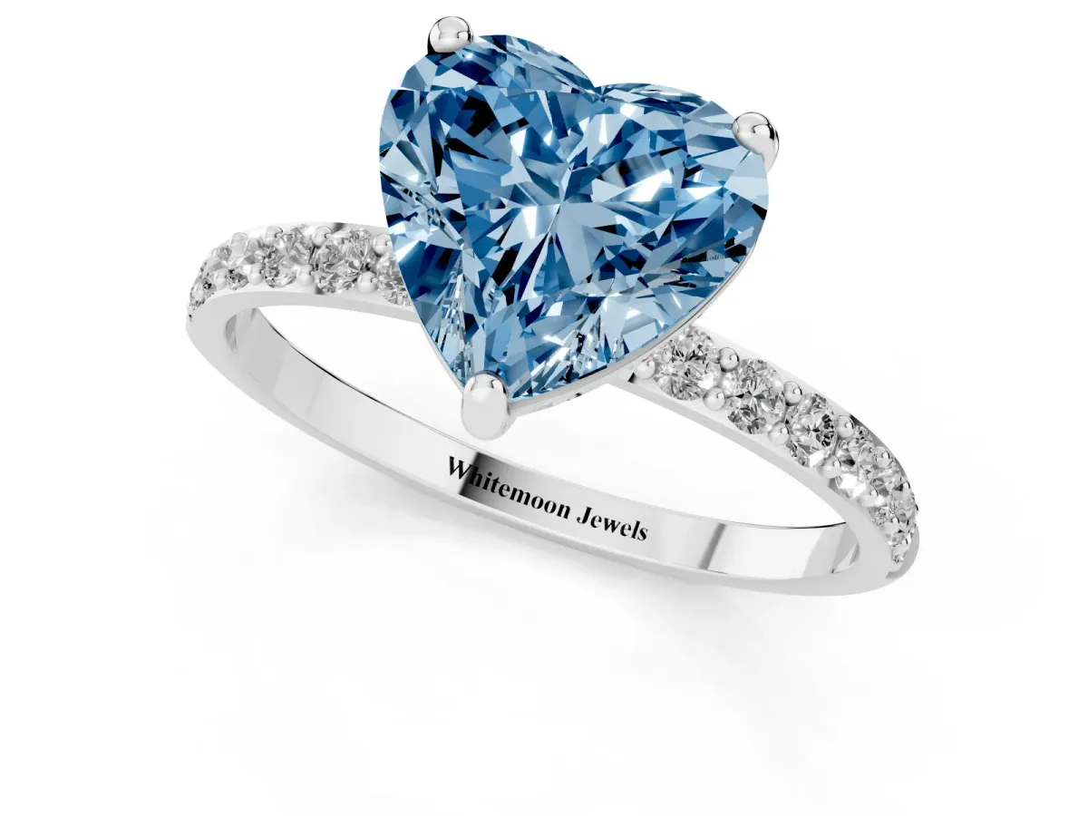 Fancy Blue Heart Cut Diamond Solitaire Ring with Round Pavé Band and Prong Setting Silver