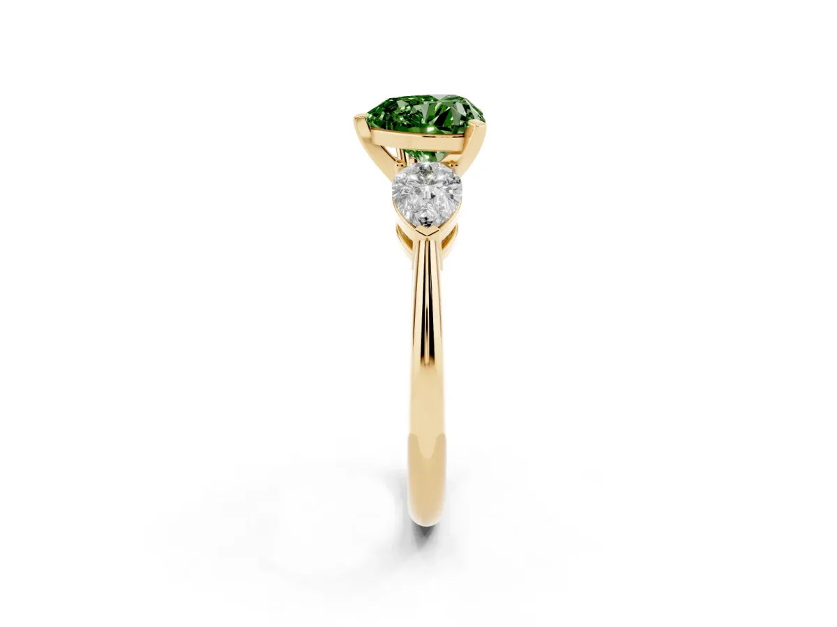Fancy Green Three-Stone Heart Cut Diamond Ring with Pear Side Stones and Four-Prong Setting Yellow gold