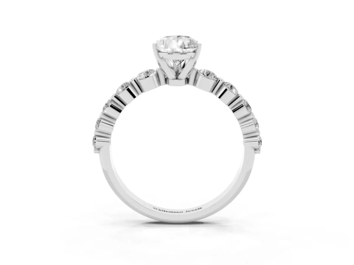 Pear Cut Solitaire Diamond Ring with Pave Band and Four-Prong Setting Silver