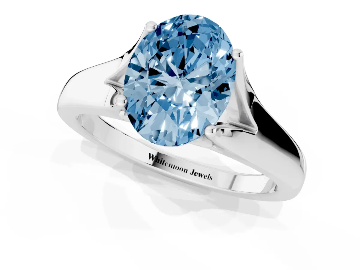 Fancy Blue Oval Cut Solitaire Diamond Ring with Cathedral Band and Four-Prong Setting Platinum